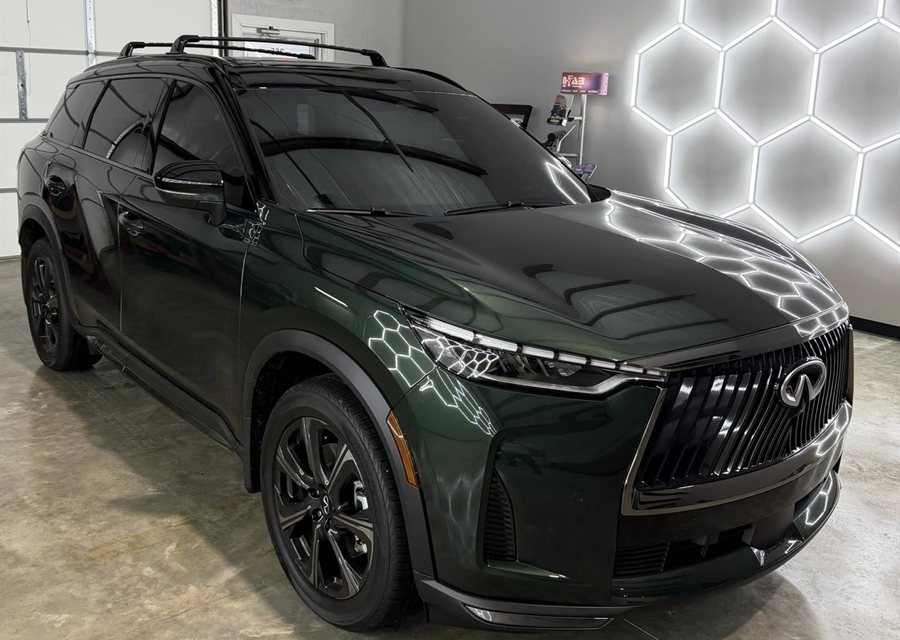Window tint on a green INFINITI QX80 at Garrett Tinting in Bryant, AR